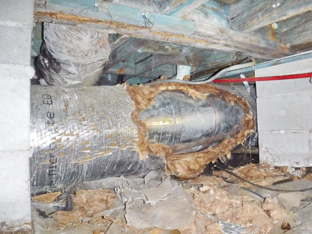 worn duct in crawlspace