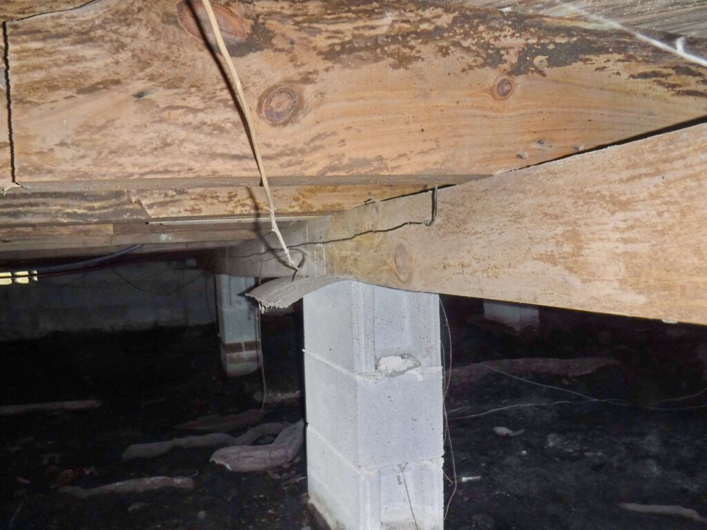 Girder sags in crawlspace.