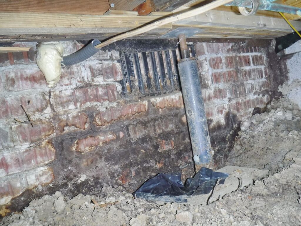 screw jack pictured used as floor support